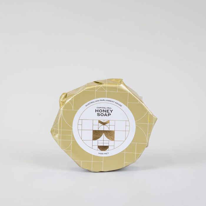 front cover of honey soap packaged in gold wrapping paper