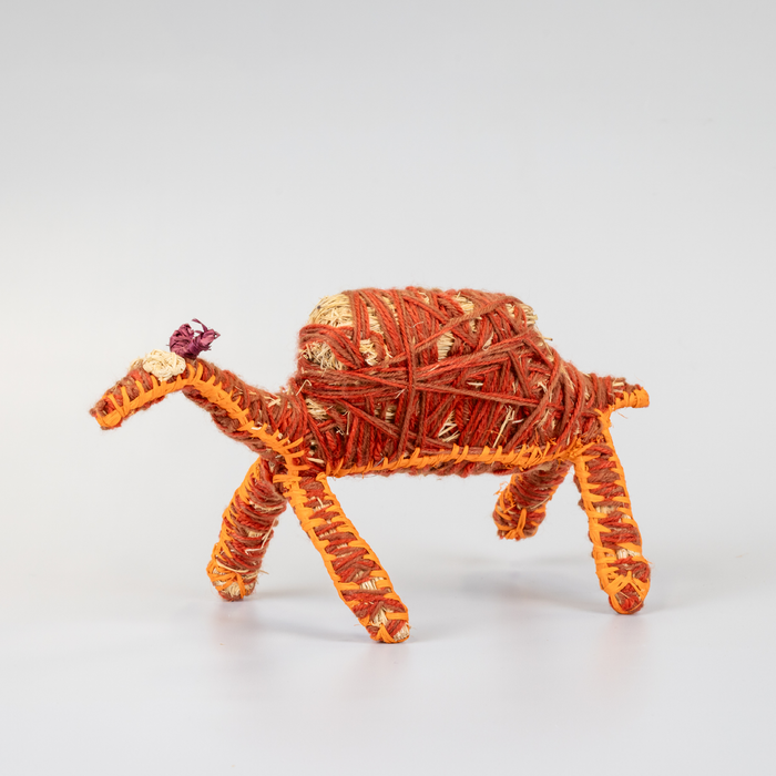 Grass woven camel sculpture in red and orange