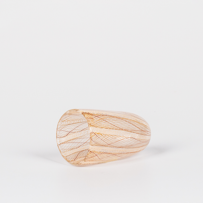 Miniature rounded glass vessel with intricate yellow and brown swirl design