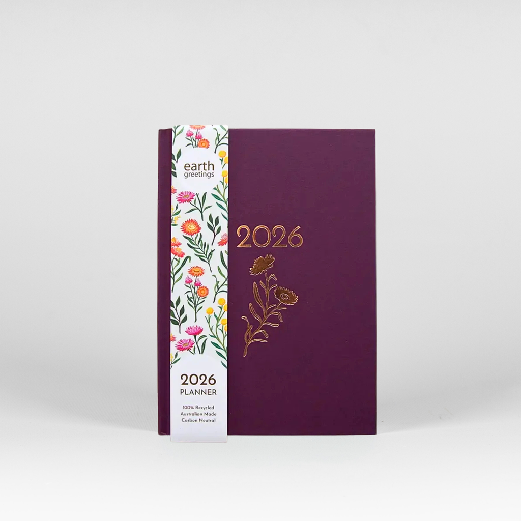 Purple planner with floral design and '2026' text on a white background