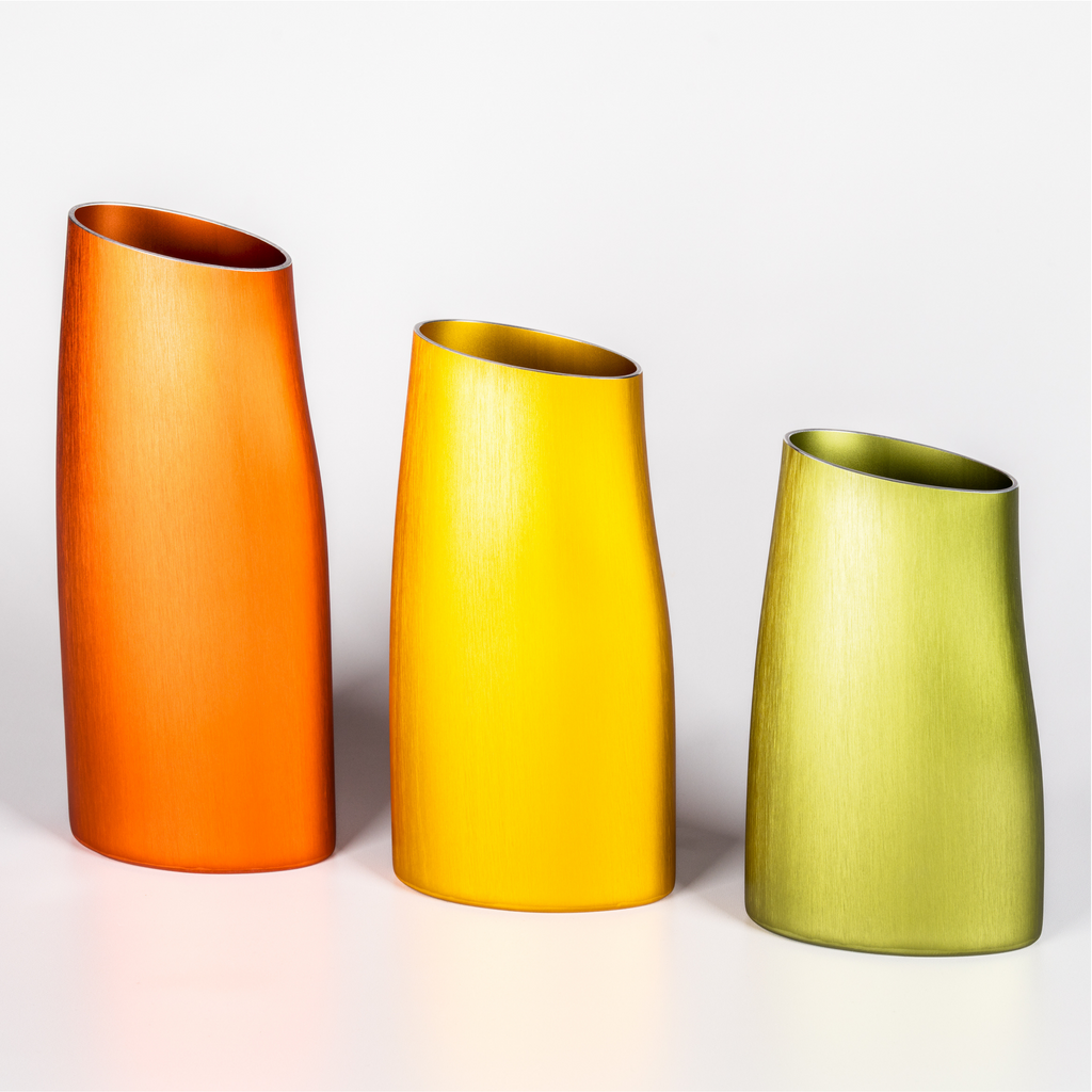 Set of three decorative vases: orange, yellow and green aluminium vases