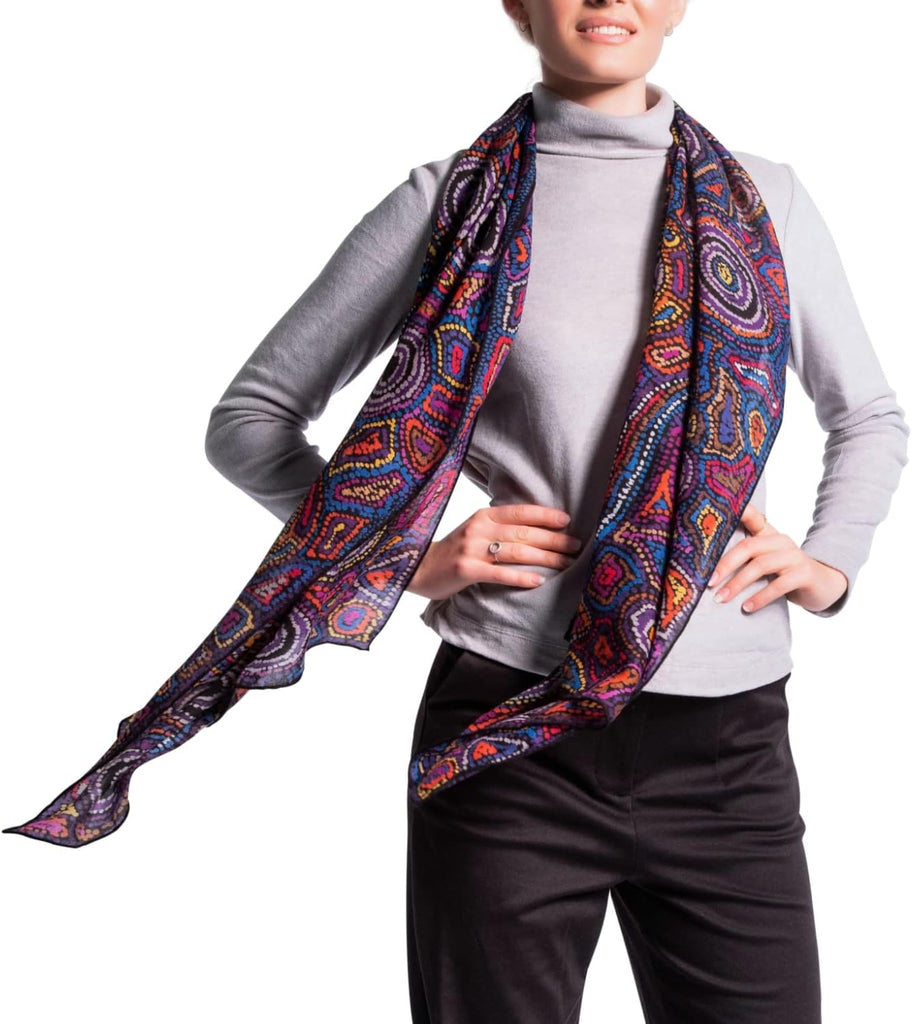 woman wearing purple wool scarf with traditional patterns 