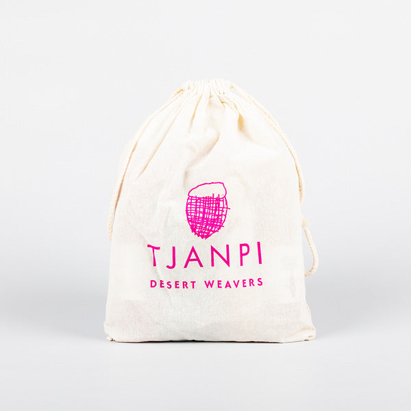 Canvas drawstring bag with 'Tjanpi Desert Weavers' logo