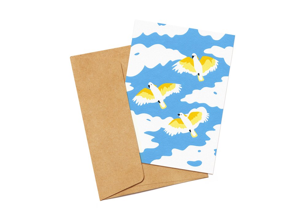 Gift card featuring an illustration of flying Cockatoos and a brown envelope