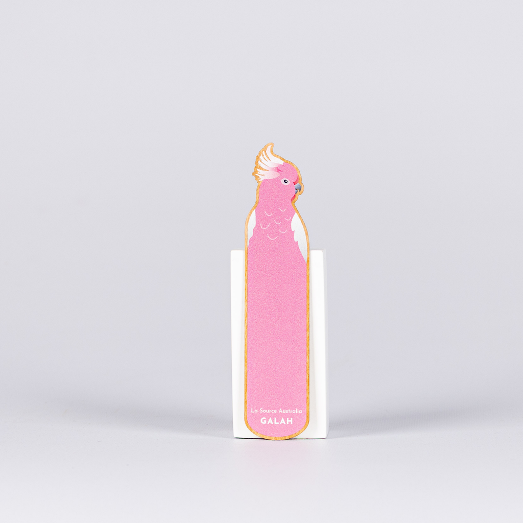 Pink bird-shaped notepad with a white background