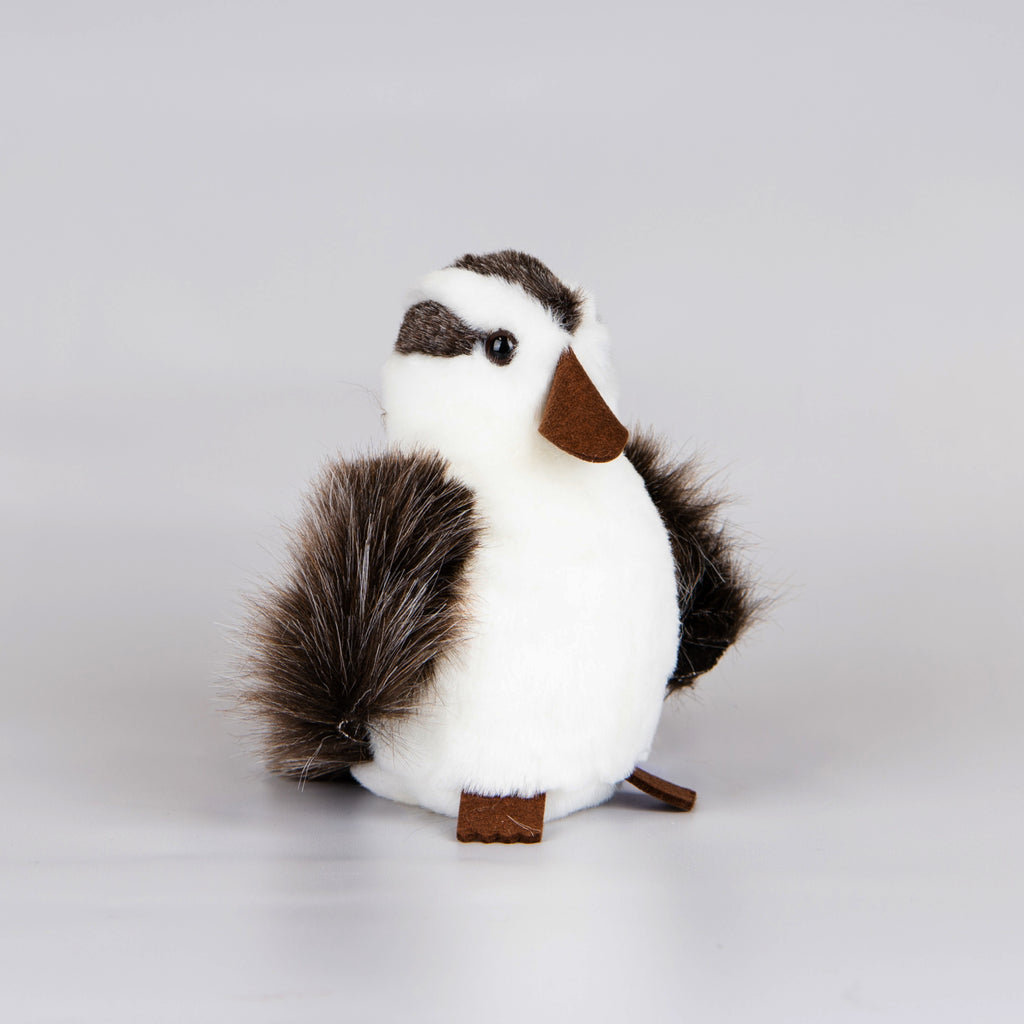Plush brown and white kookaburra toy.