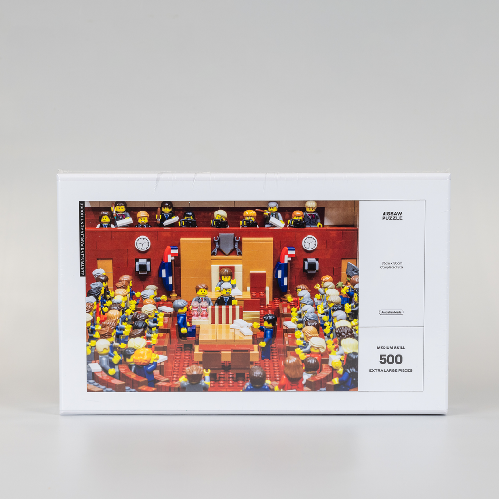 front cover of a white jigsaw puzzle box featuring a lego version of the senate chamber
