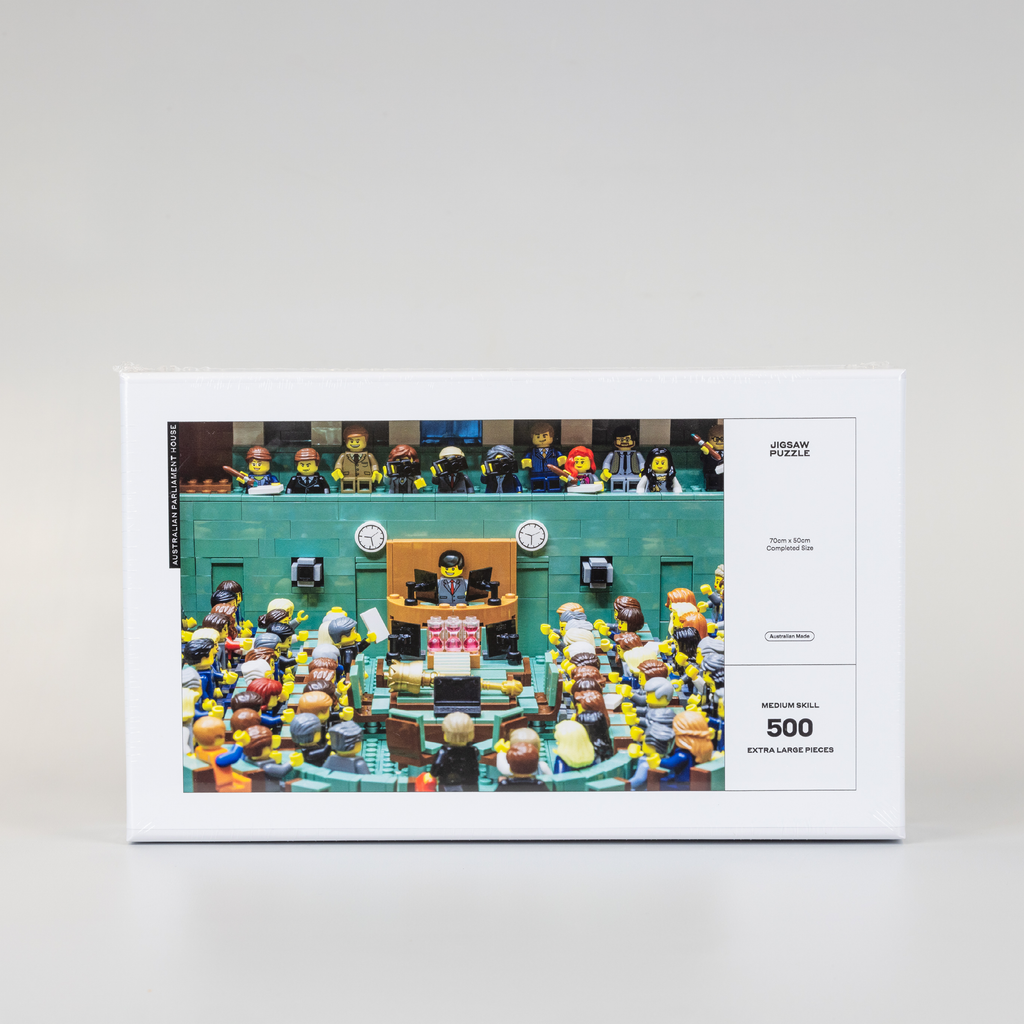 front cover of a white jigsaw puzzle box featuring a lego version of the house of representatives chamber
