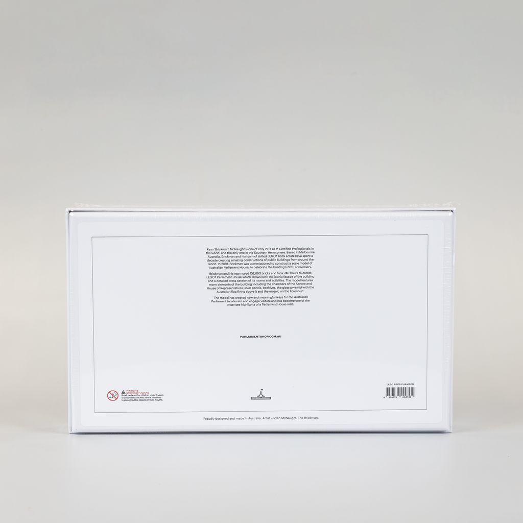 back cover of a white jigsaw puzzle box featuring a lego version of the house of representatives chamber