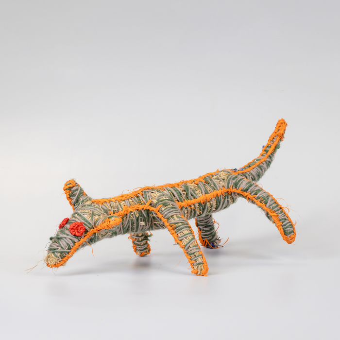 Grass woven dog sculpture in green and orange