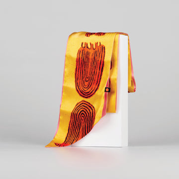 Silk scarf with vibrant yellow, orange and pink print