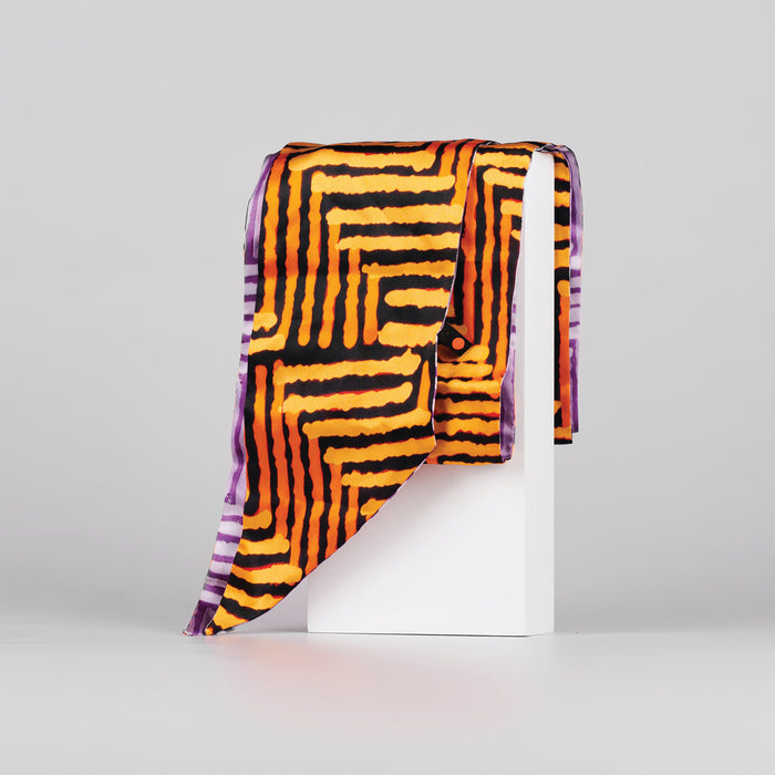 Silk scarf with vibrant black, orange and purple line print