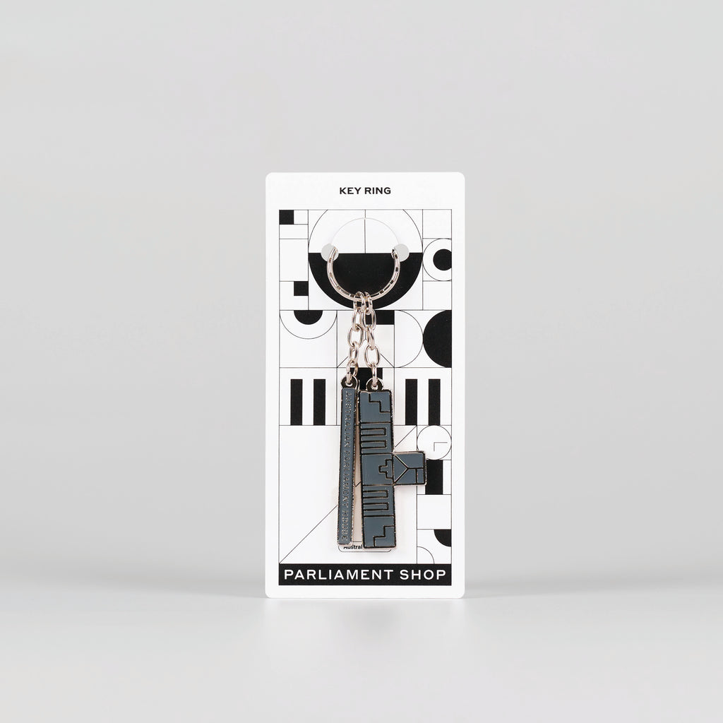 Silver abstract keychain of parliament house on backing card