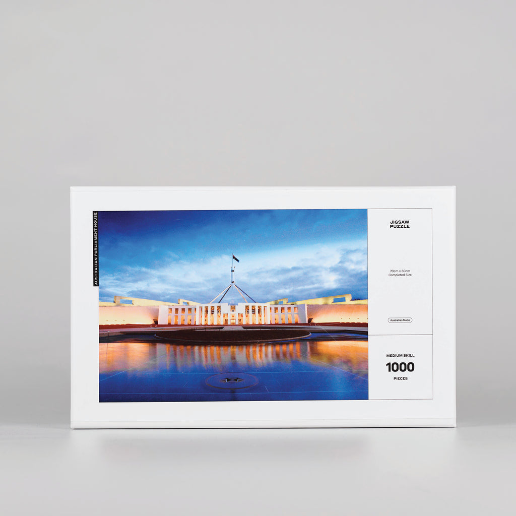 front cover of white jigsaw puzzle box featuring Parliament house