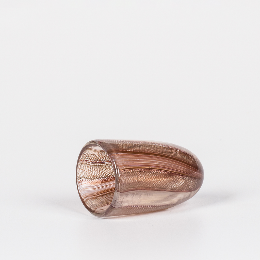 Miniature rounded glass vessel with intricate brown swirl design