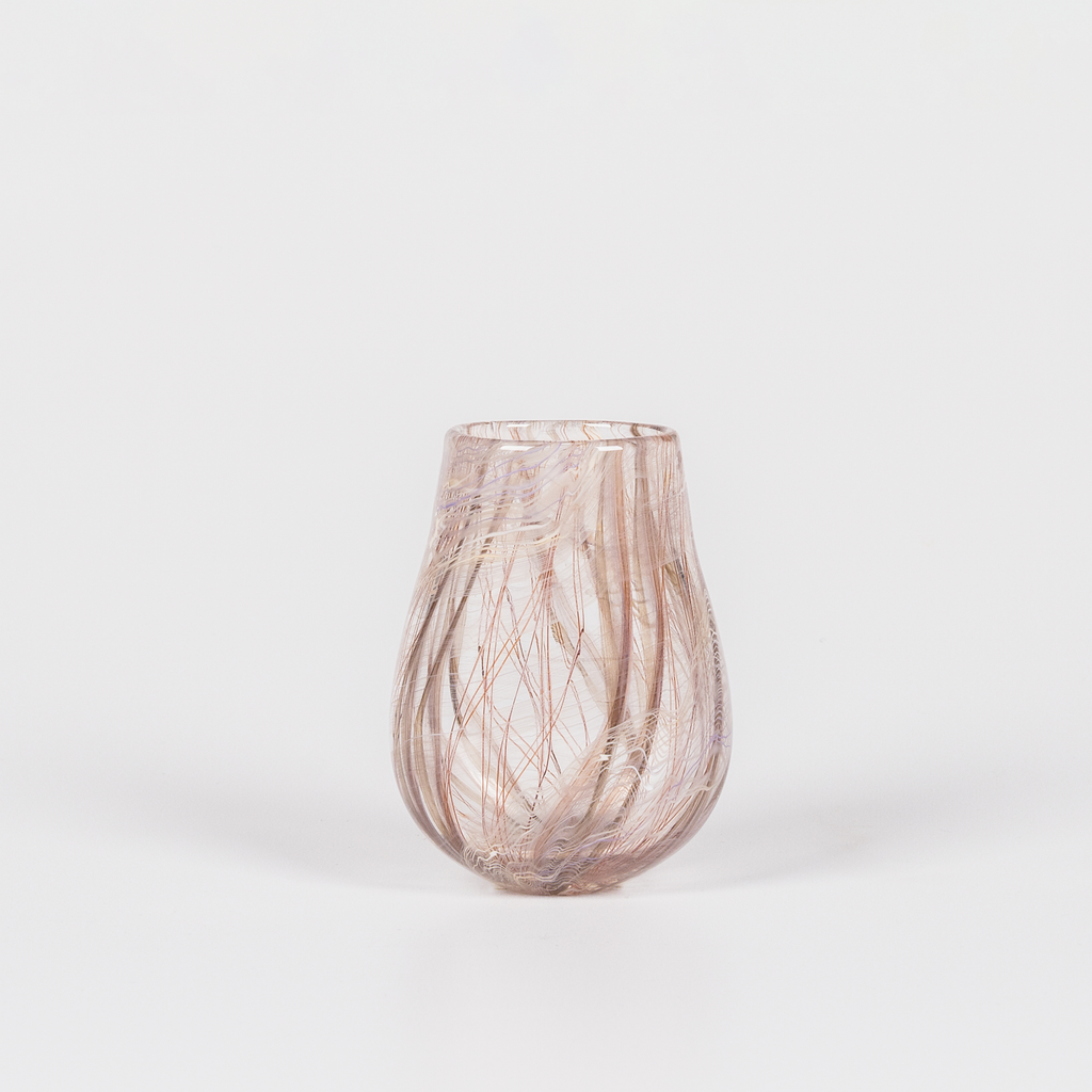 Miniature rounded glass vessel with intricate brown swirl design