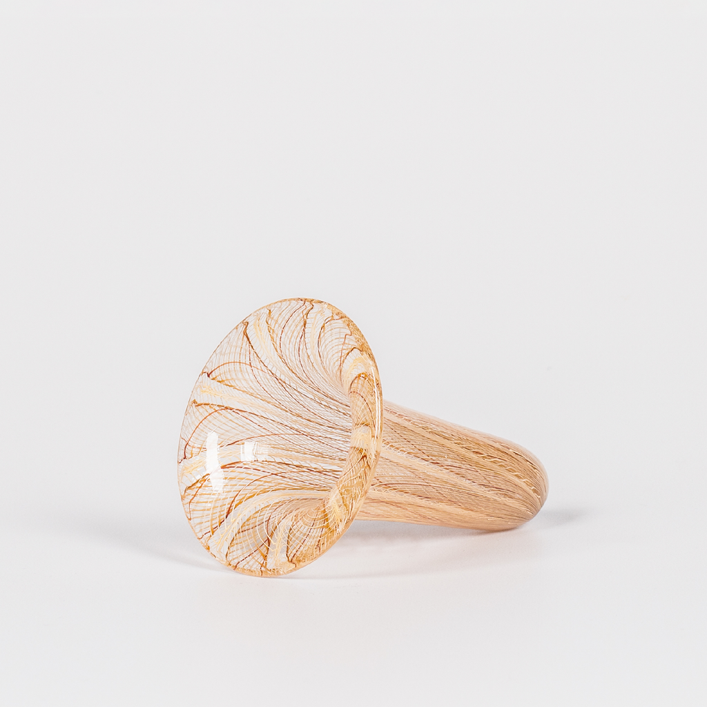 Miniature glass funnel-shaped vessel with intricate brown and yellow swirl design 