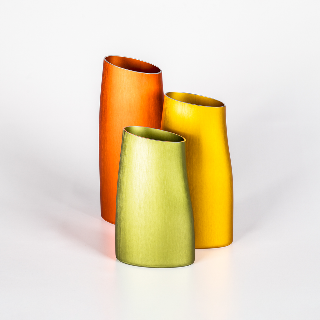 Set of three decorative vases: orange, yellow and green aluminium vases