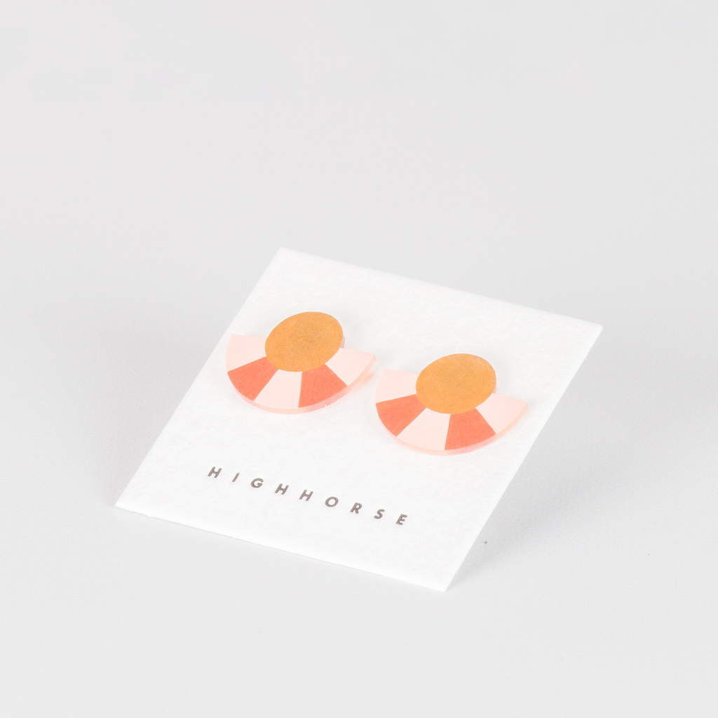 striped acrylic semicircle shaped stud earrings on backing card