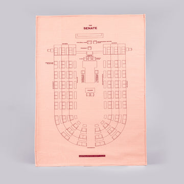 front of red tea towel featuring the Senate Chamber seating plan.