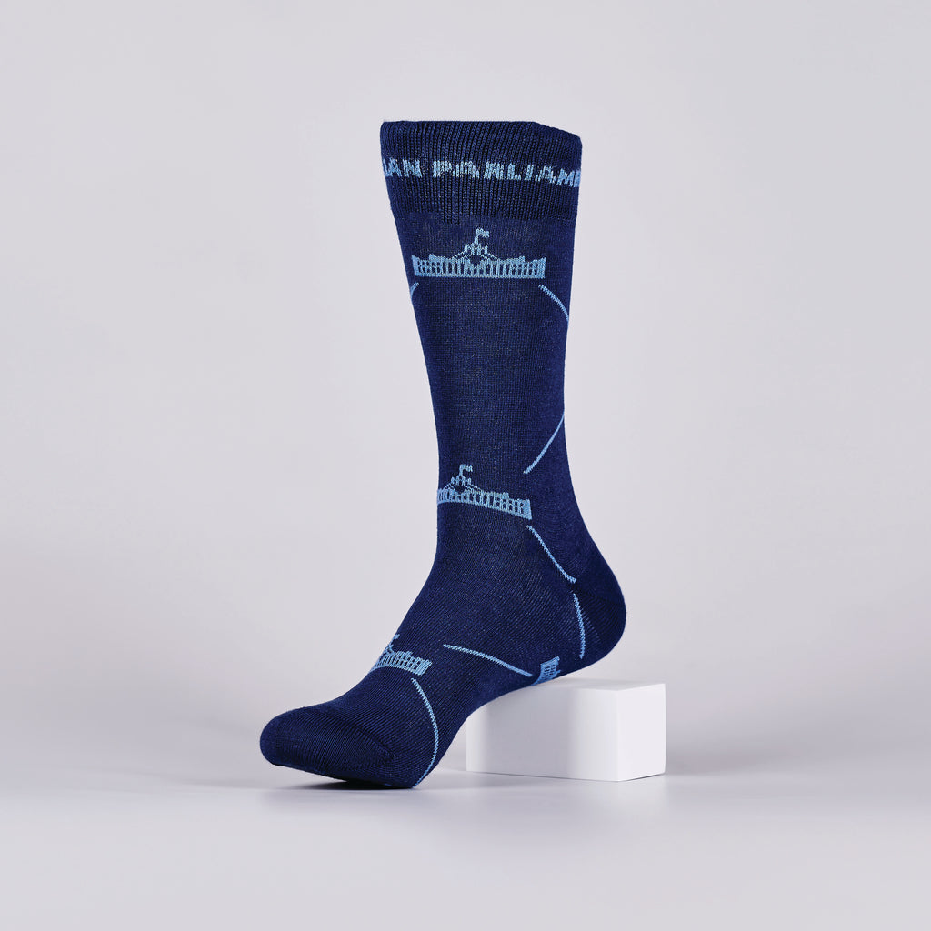 Navy sock with repeated, light blue Parliament House logos on a foot mannequin.