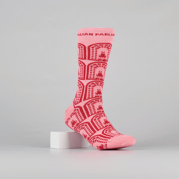 pink sock with repeated, red house of the senate logos on a foot mannequin