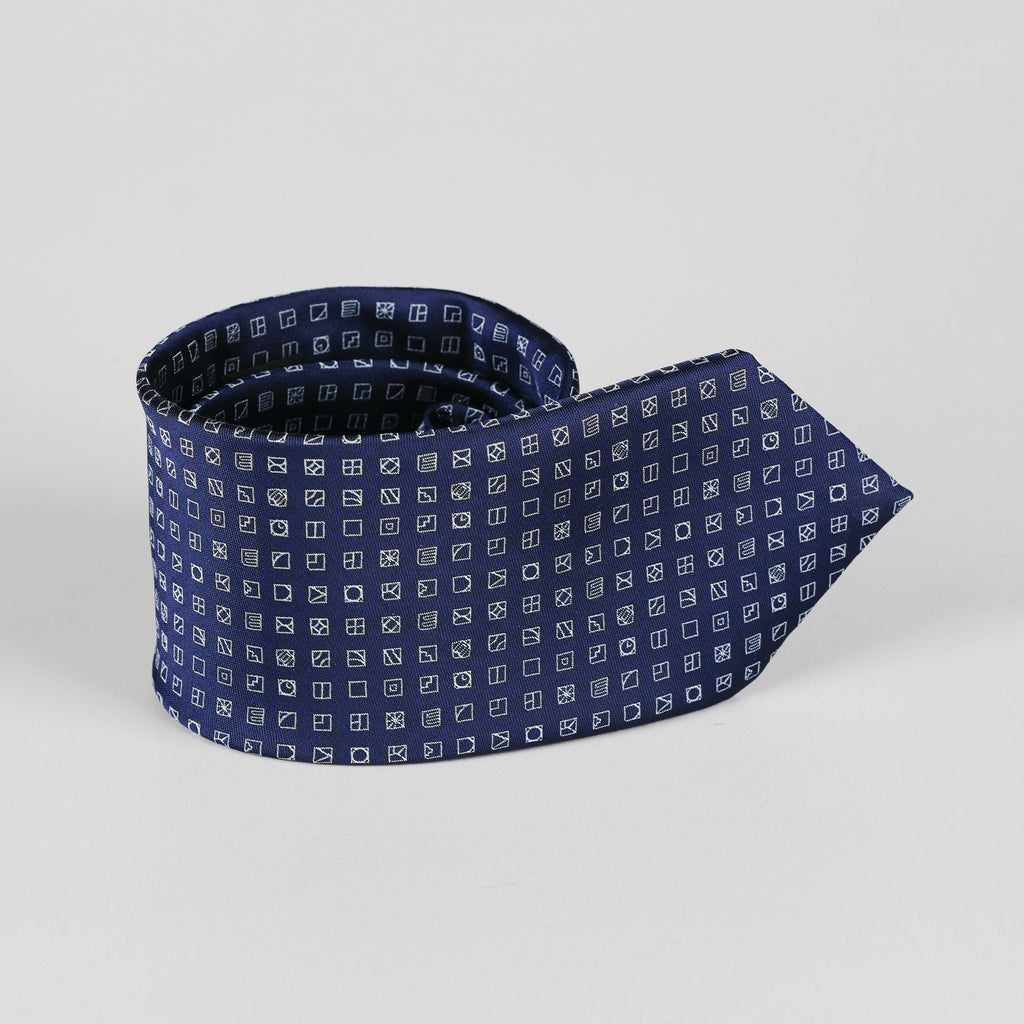 rolled navy blue tie with small square pattern