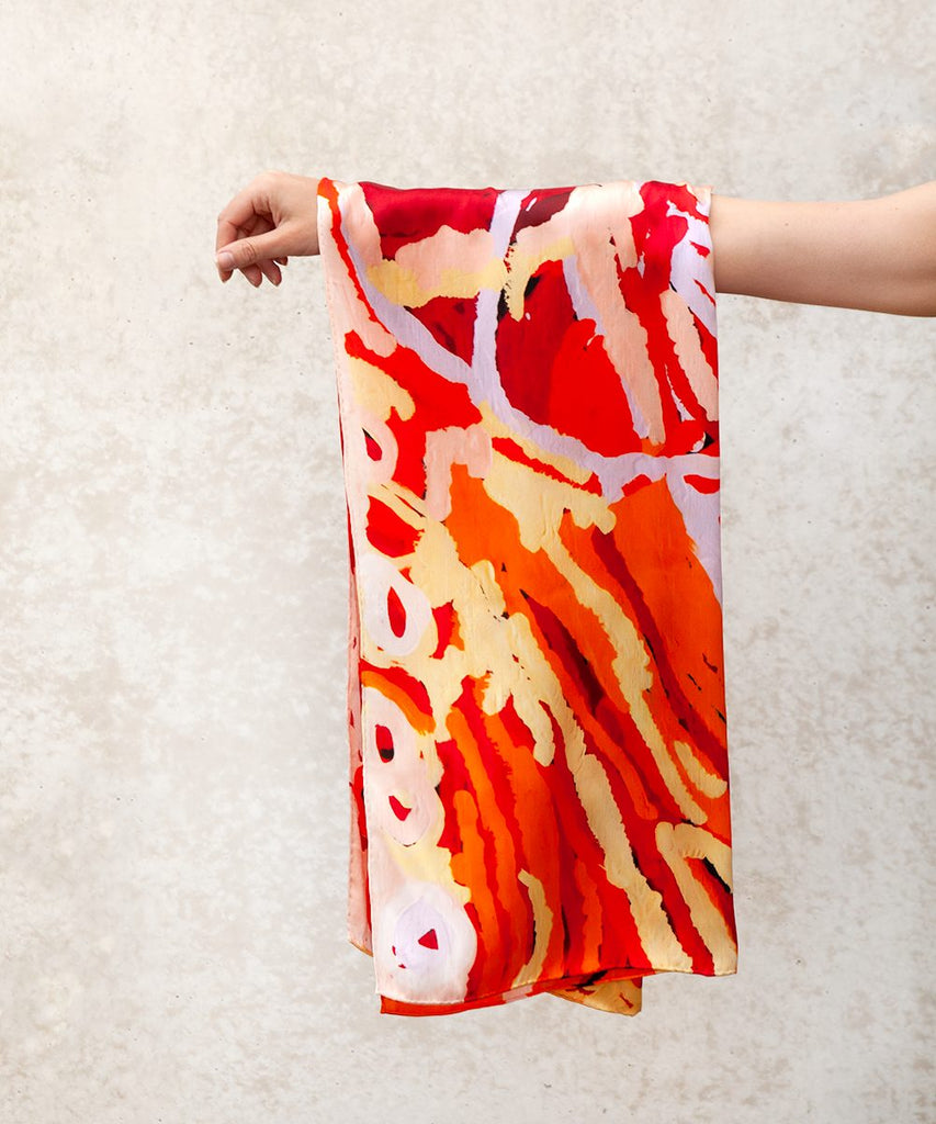 rectangle vibrant silk scarf hanging from arm