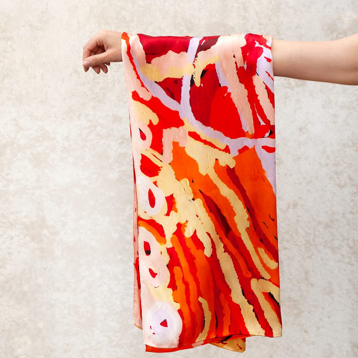 rectangle vibrant silk scarf hanging from arm