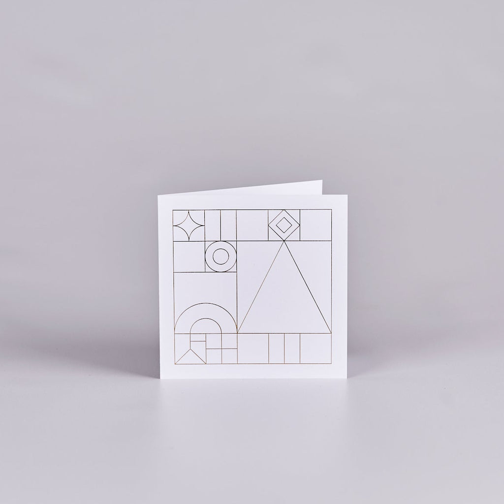 White card with a gold geometric design.