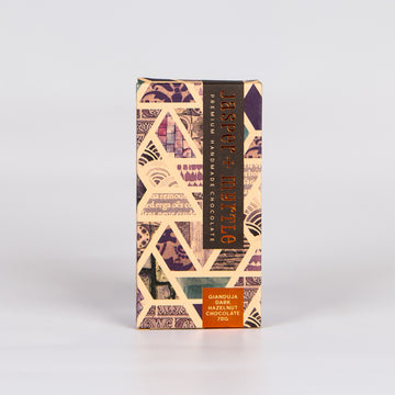 Brown chocolate box with a purple pattern.