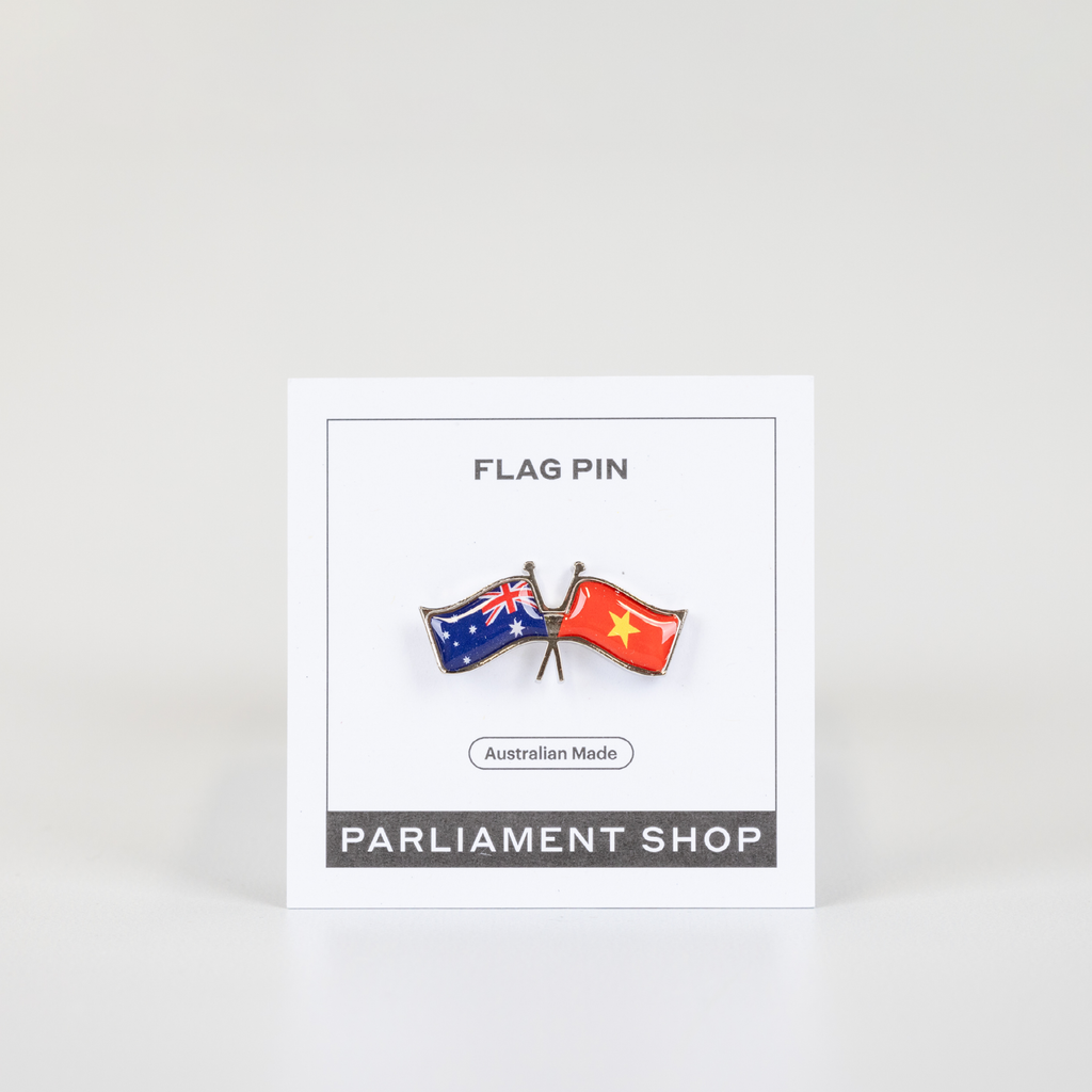 Lapel pin of Australia and Vietnam flags on white backing card