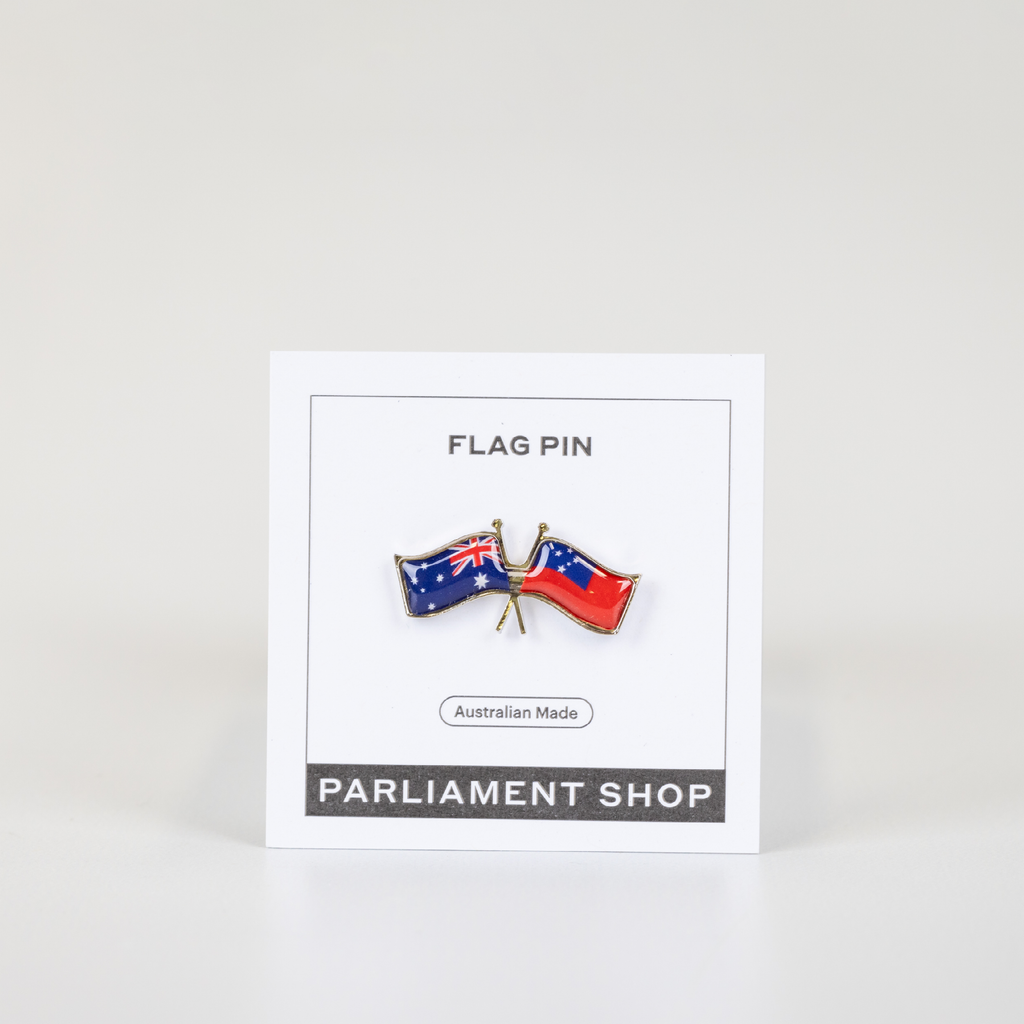 Lapel pin of Australia and Samoa flags on white backing card