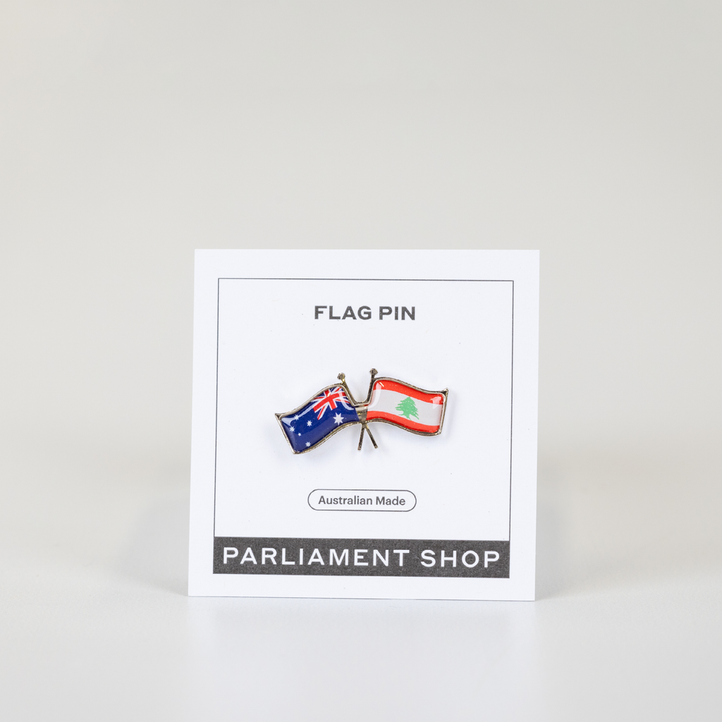 Lapel pin of Australia and Lebanon flags on white backing card