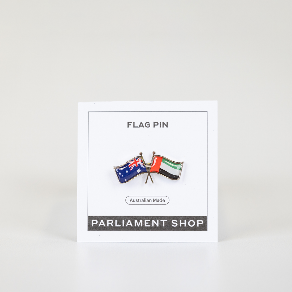 Lapel pin of Australia and United Arab Emirates flags on white backing card