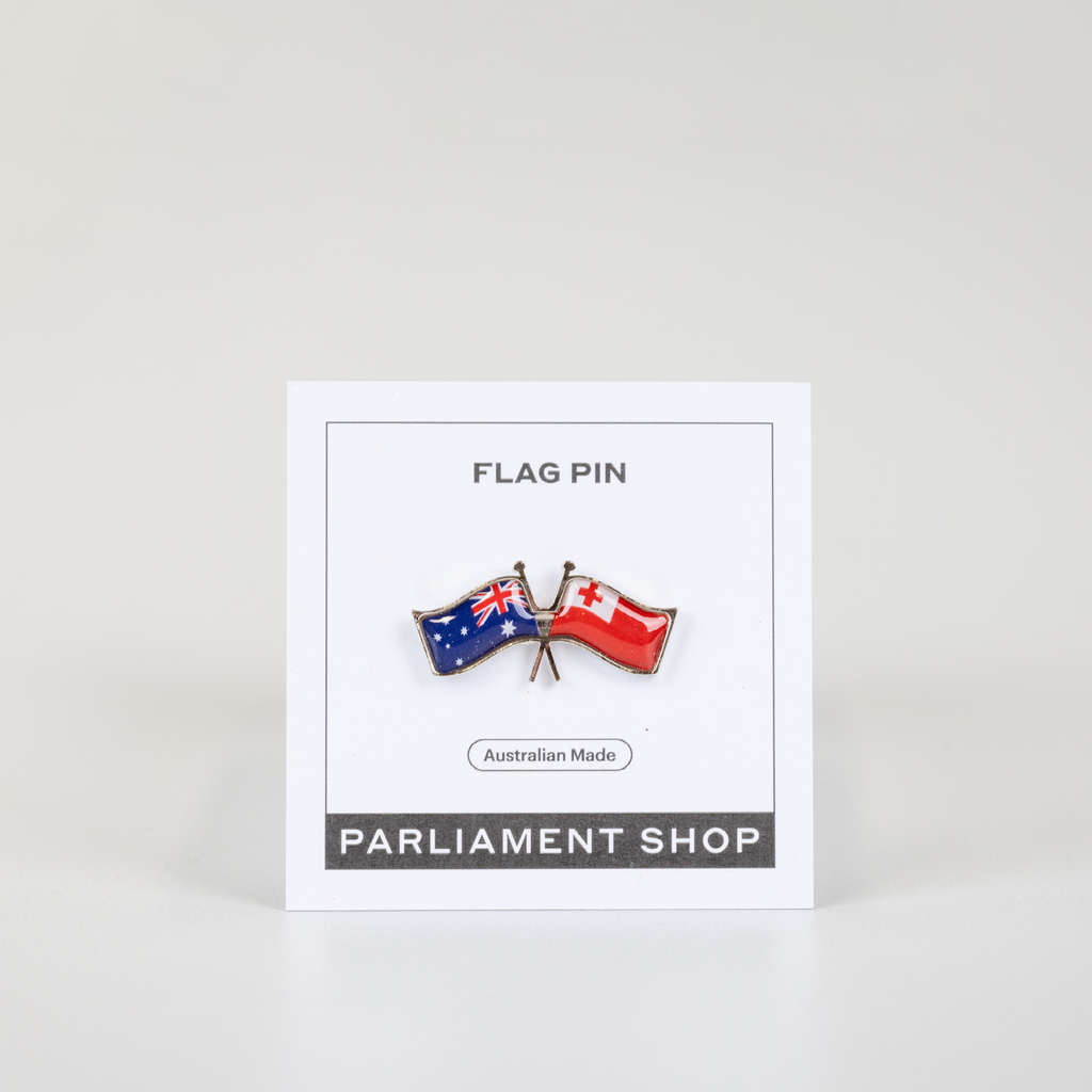 Lapel pin of Australia and Tonga flags on white backing card