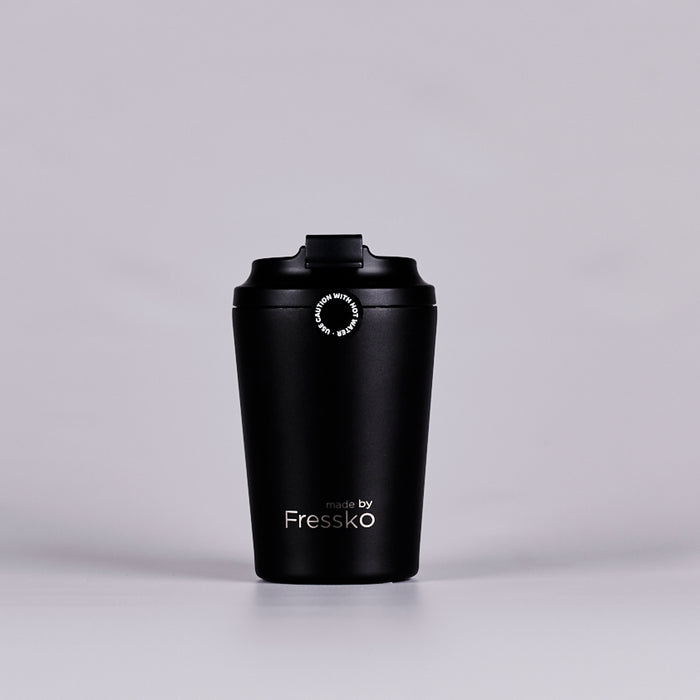 Black reusable coffee cup text reading 'made by Fressko'.