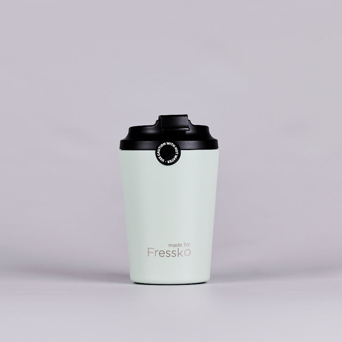 Green reusable coffee cup text reading 'made by Fressko'.