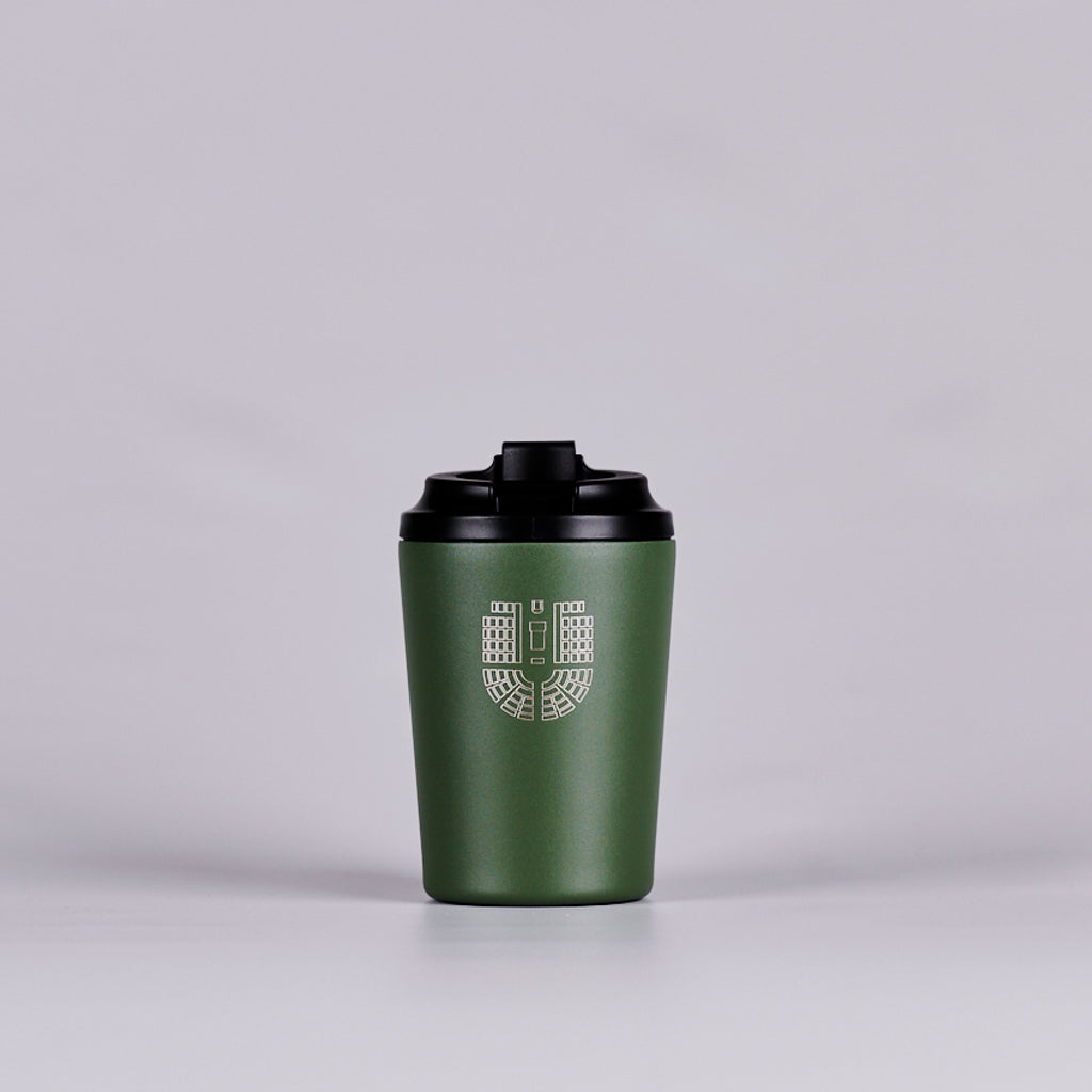 Green reusable coffee cup with gold House of Representatives Chamber seating plan.