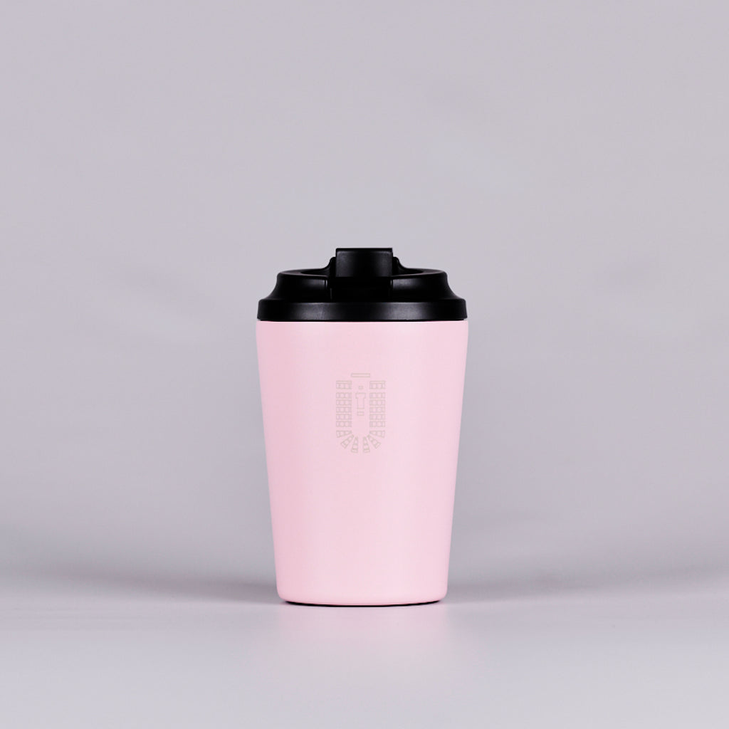 Pink reusable coffee cup with Senate Chamber seating plan.