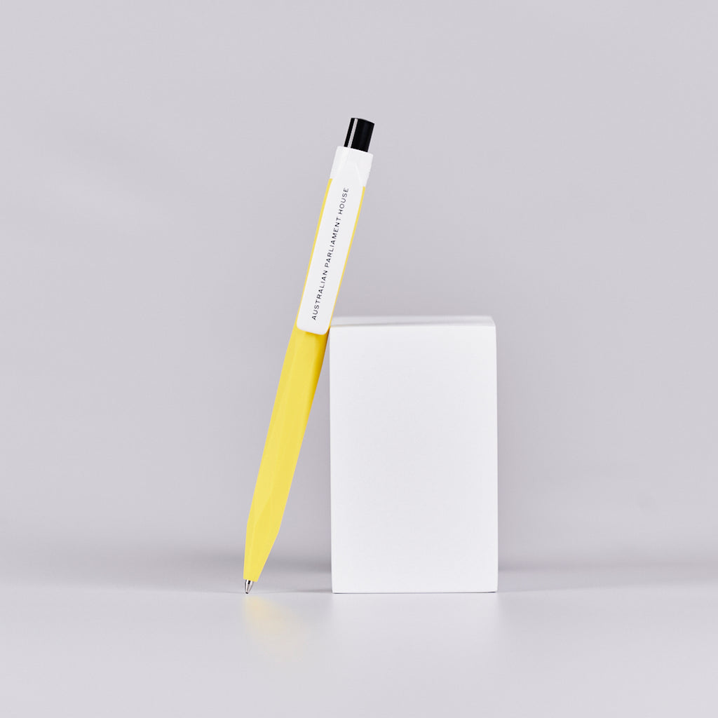 Yellow pen with text reading 'Australian Parliament House' printed on it. 
