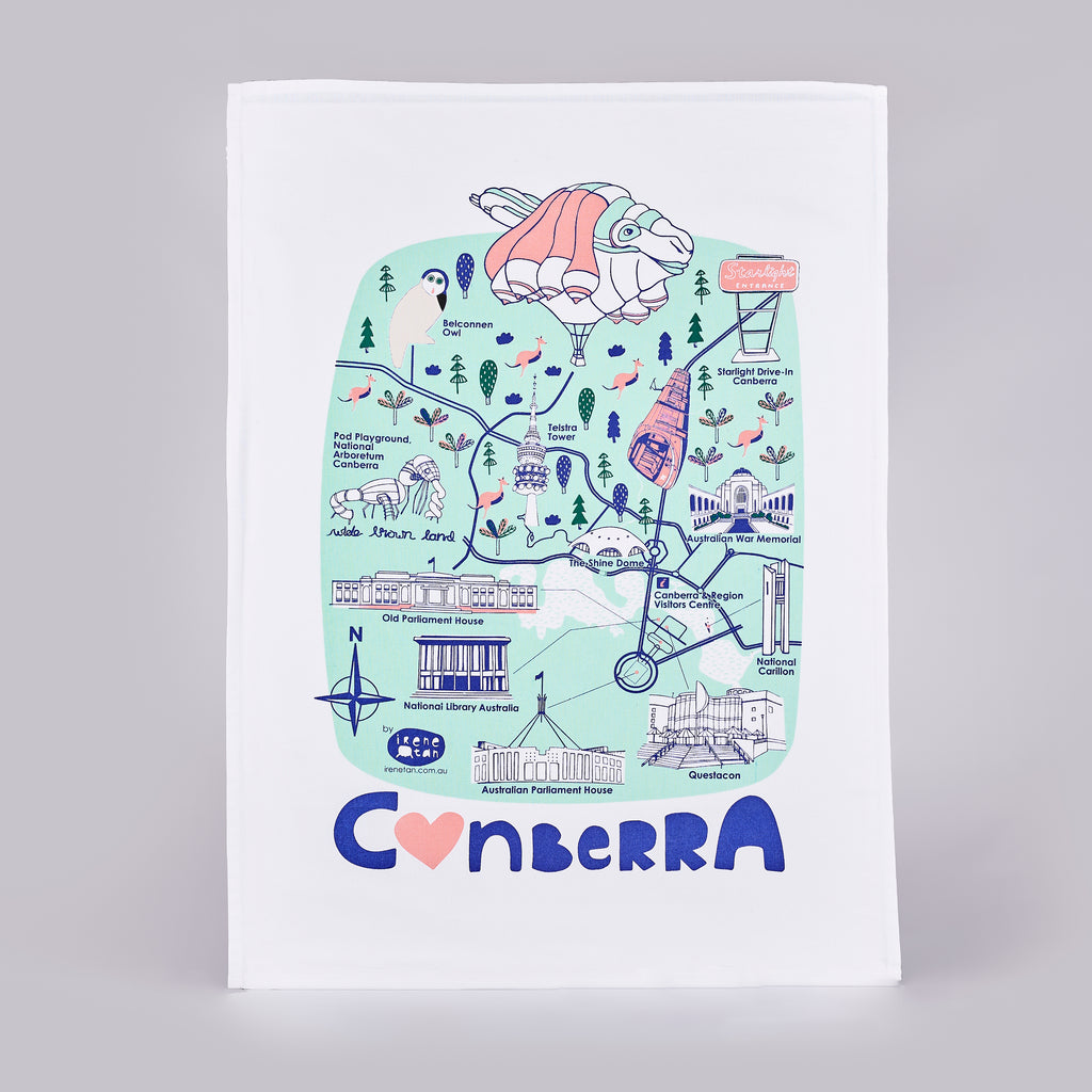 White, blue and pink tea towel with illustrations of Canberra locations and the word 'Canberra'.