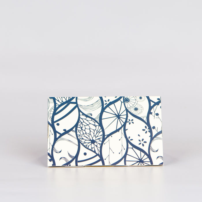White chocolate box with a white and blue pattern.