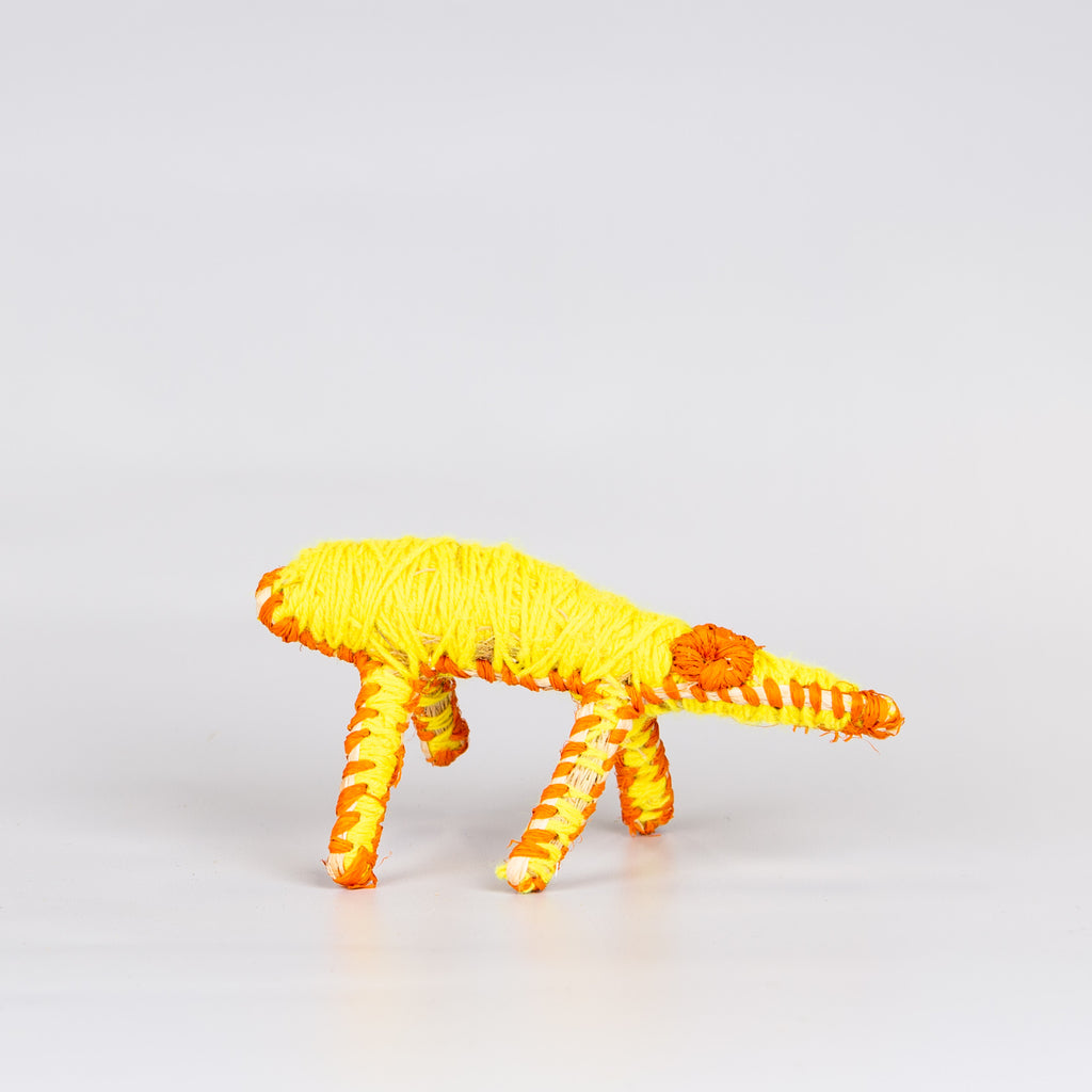 Grass woven lizard sculpture in yellow.
