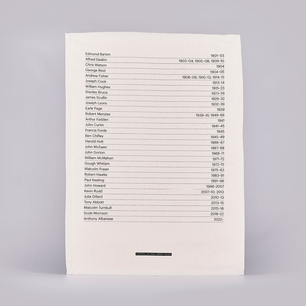 Tea towel with a black text listing 31 prime minister names and their tenures.