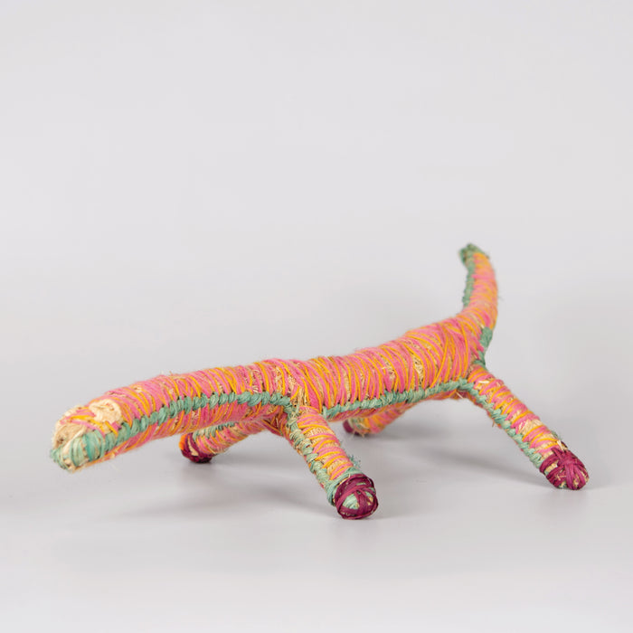 Grass woven lizard sculpture in pink and yellow
